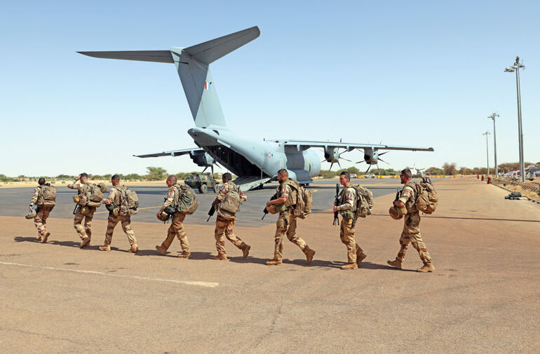 French soldiers lower flag after years of occupation in the Malian city of Timbuktu