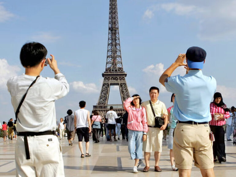 Families flock abroad as summer travel surges