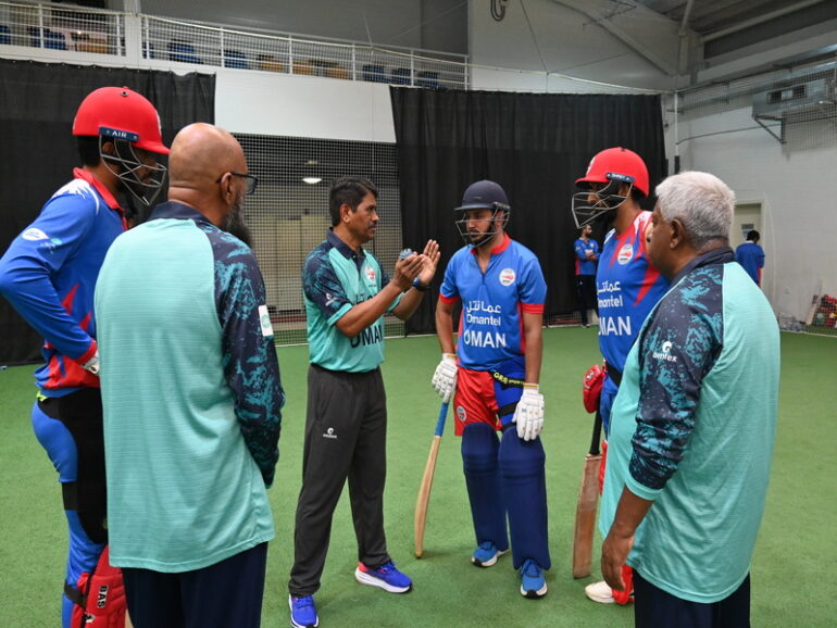 Oman cricket support staff working with the team