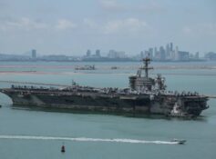 Rust covered USS Abraham Lincoln docks in Thailand