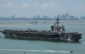 Rust covered USS Abraham Lincoln docks in Thailand